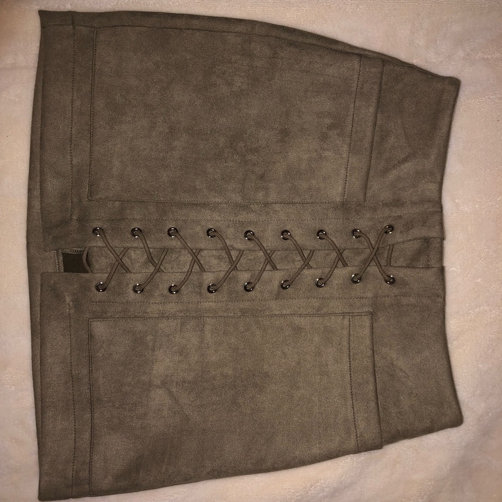 Mini skirt made from suede-like material with a lace up front… NWOT never worn